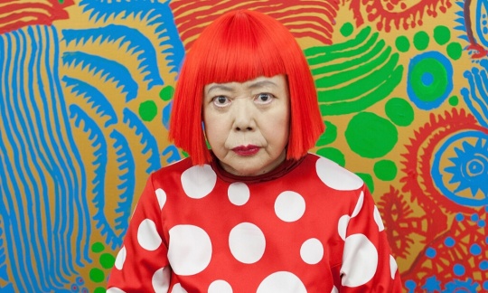  Yayoi Kusama sits in front of one of her newly finished paintings in her studio. Photograph: Jeremy Sutton-Hibbert/Getty Images
